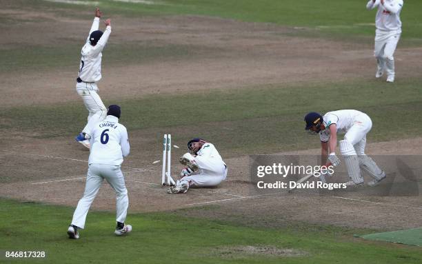 Matthew Lamb of Warwickshire stretches to make his ground as Essex wicket keeper James Foster attempts to run him out during the Specsavers County...