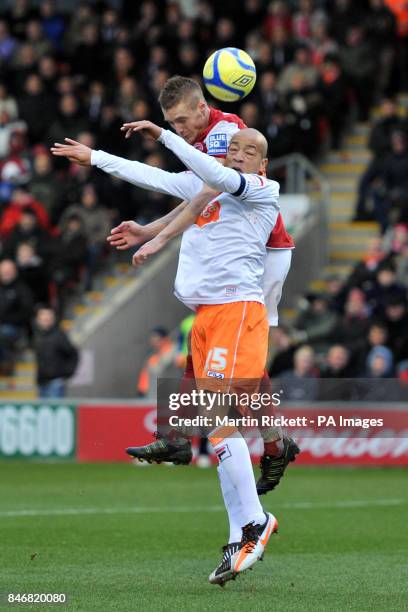 Blackpool's Alex Baptiste and Fleetwood Town's Jamie Vardy battle for the ball in the air