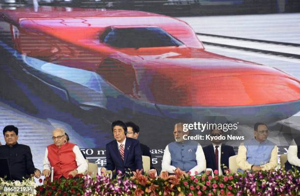 Japanese Prime Minister Shinzo Abe and Indian Prime Minister Narendra Modi attend the ground breaking ceremony in Ahmadabad, India, on Sept. 14 to...