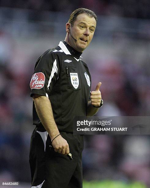 Referee Rob Styles reacts with a gesture as he looks on during an English FA Premier League football match as Sunderland and Stoke City vie at the...