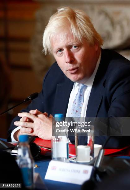 Britain's Foreign Secretary Boris Johnson reacts during a meeting with US Secretary of State Rex Tillerson at Lancaster House on September 14, 2017...