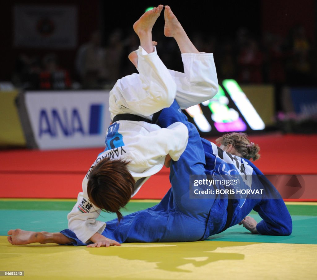 Japan's Emi Yamagishi (white) battles wi