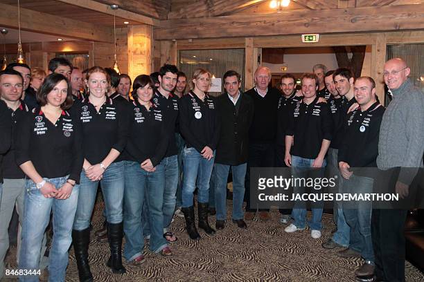 French Prime Minister Francois Fillon and French Secretary of State for Sport Bernard Laporte pose with the French ski team at the World Ski...