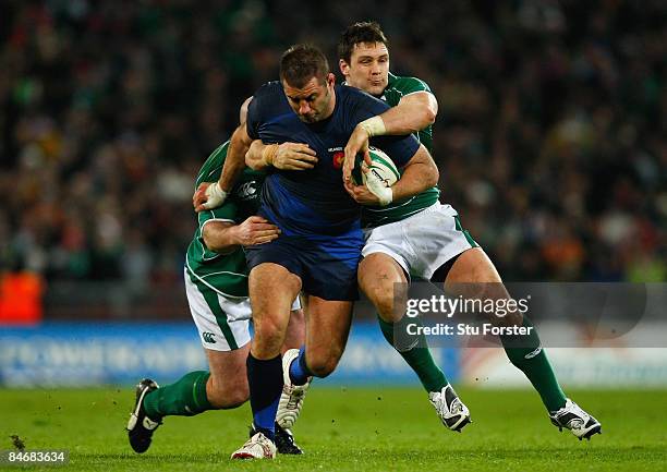 Lionel Faure of France is tackled by John Hayes and David Wallace of Ireland during the RBS 6 Nations Championship match between Ireland and France...