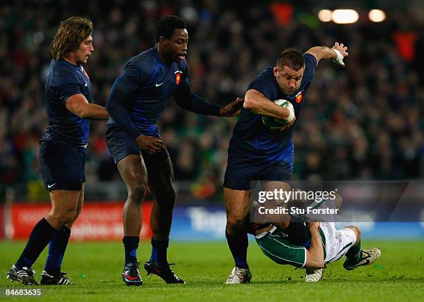 Lionel Faure of France is tackled by Paddy Wallace of Ireland during the RBS 6 Nations Championship match between Ireland and France at Croke Park on...