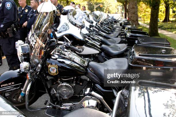 police escort officers and motorcycles at annual benefit rally - police motorbike stock pictures, royalty-free photos & images