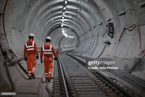 Crossrail engineers inspect the completed track as the Crossrail project celebrates the completion of the Elizabeth line track, on September 14, 2017...