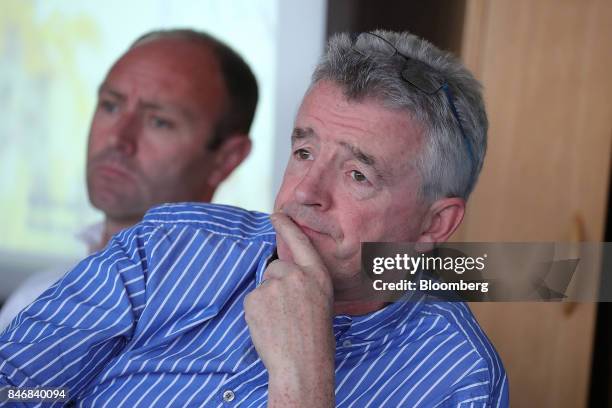 Michael O'Leary, chief executive officer of Ryanair Holdings Plc, right, looks on as he sits beside Kenny Jacobs, chief marketing officer of Ryanair...