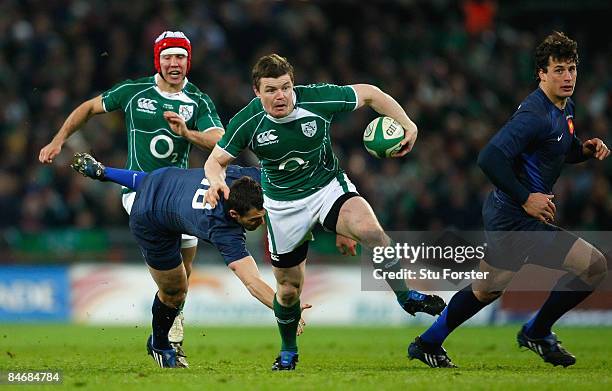 Brian O'Driscoll of Ireland breaks clear of the tackle of Lionel Beauxis of France to score his team's second try during the RBS 6 Nations...