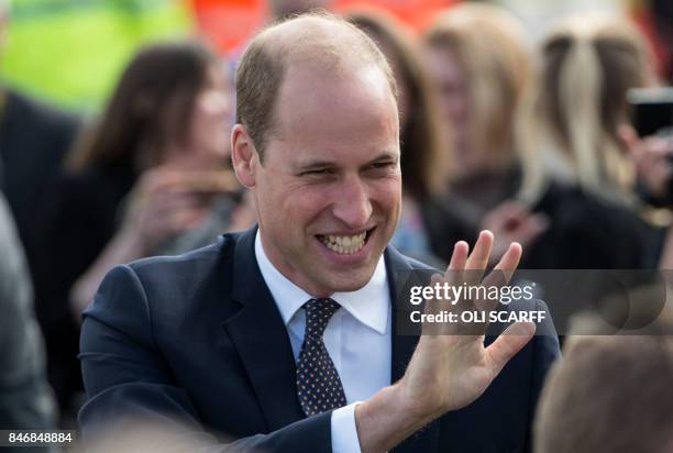 Britain's Prince William, Duke of Cambridge, waves as he leaves after formally opening the new Urgent Care and Trauma Centre at Aintree University...