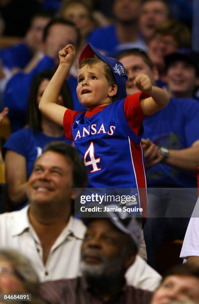 Young Kansas fan cheers during the game between the Oklahoma State Cowboys and the Kansas Jayhawks on February 7, 2009 at Allen Fieldhouse in...