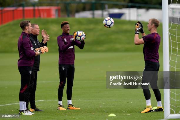 Joe Hart of West Ham United warms up with Adrian San Miguel , Chris Woods and Nathan Trott during training at Rush Green on September 14, 2017 in...