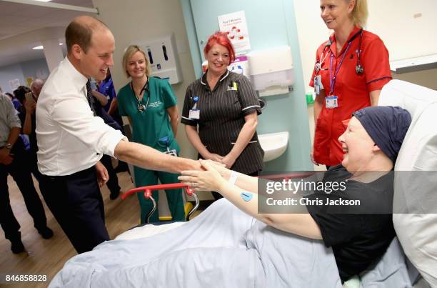 Prince William, Duke of Cambridge chats with cancer patient Pagan Tordengrav during a visit to Aintree University Hospital on September 14, 2017 in...