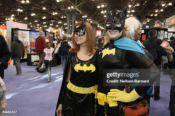 Fans pose as their favorite comic book and science fiction character 'Batgirl' at the 2009 New York Comic Con at the Jacob Javits Center on February...