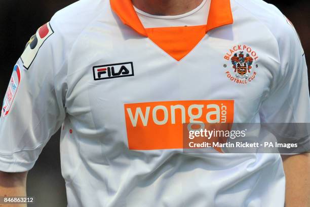 Detail of Blackpool FC match kit and Wonga.com sponsorship on the front