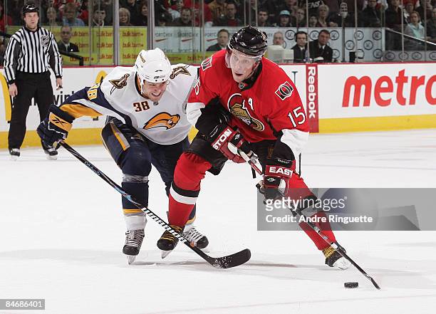 Dany Heatley of the Ottawa Senators stickhandles the puck against Patrick Kaleta of the Buffalo Sabres at Scotiabank Place on February 7, 2009 in...