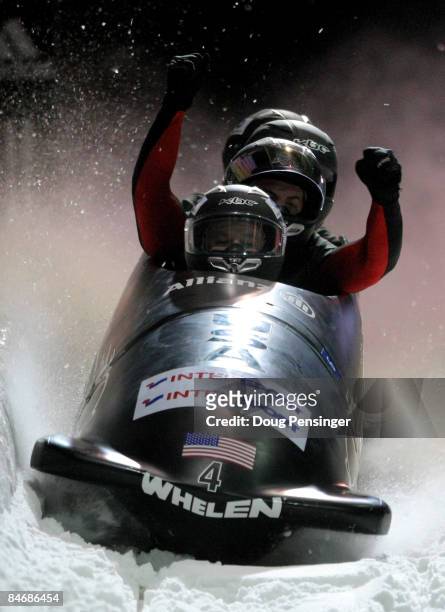 Driver Steven Holcomb of the USA and his crew celebrate after their second run as they finished second in the men's four man bobsleigh finals at the...