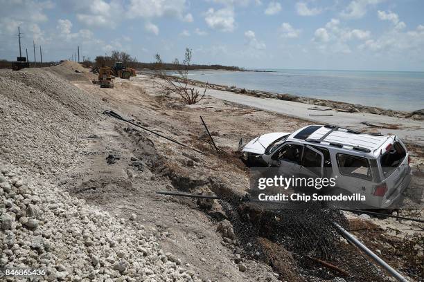 Storm damaged truck sits mired in the sand close to where Hurricane Irma washed out the two northbound lanes of Highway 1 September 13, 2017 in Bahia...