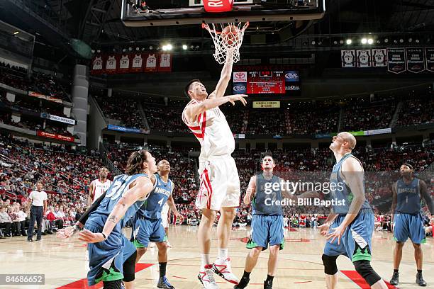 Yao Ming of the Houston Rockets shoots the ball over Mike Miller, Kevin Love, Randy Foye and Brian Cardinal of the Minnesota Timberwolves on February...