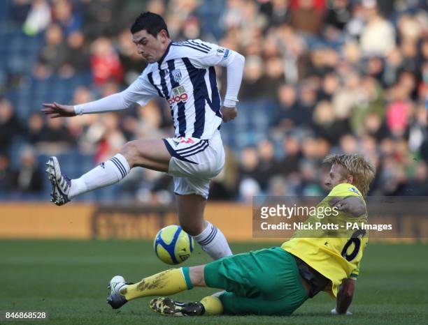 West Bromwich Albion's Graham Dorrans is tackled by Norwich City's defender Zak Whitbread during the FA Cup, Fourth Round match at The Hawthorns,...