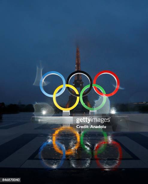 Olympic rings illuminate at place du Trocadero near the Eiffel Tower during the Paris 2024 Olympic bid victory celebrations in Paris, France on...