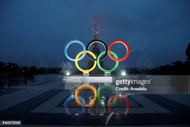 Olympic rings illuminate at place du Trocadero near the Eiffel Tower during the Paris 2024 Olympic bid victory celebrations in Paris, France on...