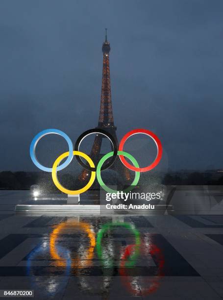 Olympic rings illuminate at place du Trocadero near the Eiffel Tower during the Paris 2024 Olympic bid victory celebrations in Paris, France on...