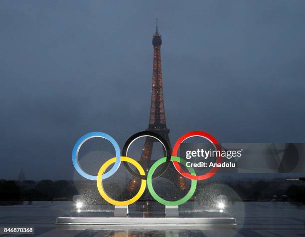 Olympic rings illuminate at place du Trocadero near the Eiffel Tower during the Paris 2024 Olympic bid victory celebrations in Paris, France on...