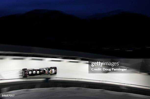 Competitors descend the track in the men's four man bobsleigh finals at the FIBT Bobsleigh and Skeleton World Cup at the Whistler Sliding Center on...