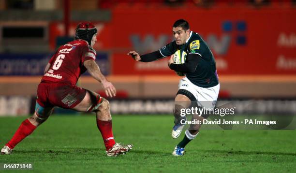 London Irish's Daniel Bowden ties to evade Llanelli Scarlets' Matt Gilbert during the LV=Cup match at Parc Y Scarlets, Llanelli.