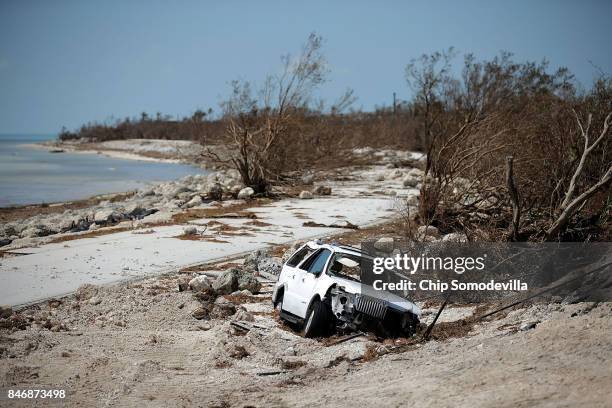 Storm damaged truck sits mired in the sand close to where Hurricane Irma washed out the two northbound lanes of Highway 1 September 13, 2017 in Bahia...