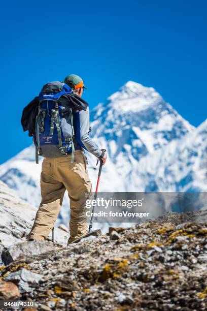 mountaineer hiking mountain pass below mt everest peak himalayas nepal - gokyo valley stock pictures, royalty-free photos & images