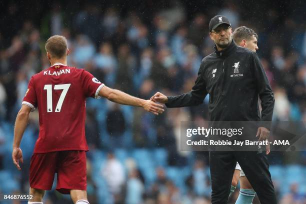 Ragner Klavan of Liverpool and Jurgen Klopp manager / head coach of Liverpool dejected during the Premier League match between Manchester City and...