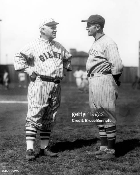 Manager Casey Stengel of the Toledo Mud Hens talks with manager John McGraw of the New York Giants before an exhibition game on April 8, 1926 in...