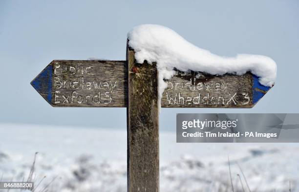 Snow covered sign on Dunkery Hill on Exmoor in Somerset as the cold weather continues across the UK.