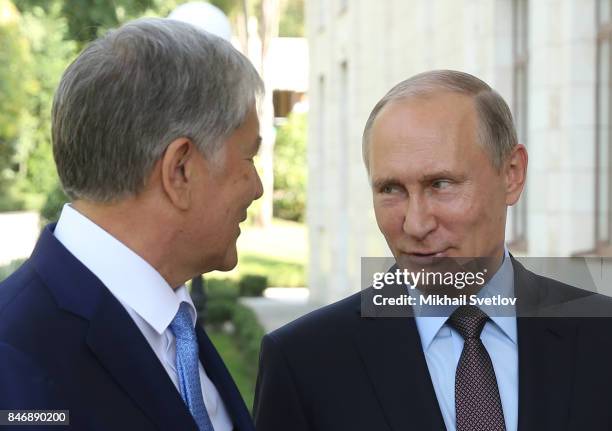 Russian President Vladimir Putin greets Kyrgyz President Almazbek Atambayev at the Bocharov Ruchey State Residence September 14, 2017 in Sochi,...