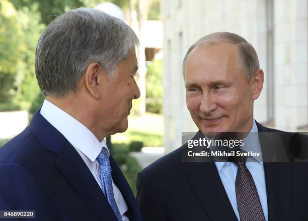 Russian President Vladimir Putin greets Kyrgyz President Almazbek Atambayev at the Bocharov Ruchey State Residence September 14, 2017 in Sochi,...