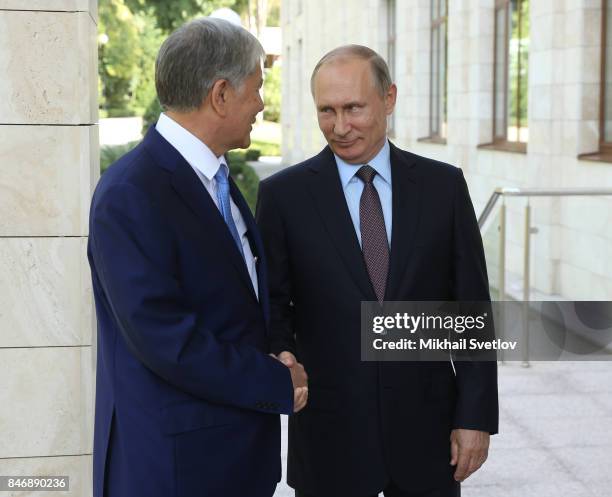 Russian President Vladimir Putin greets Kyrgyz President Almazbek Atambayev at the Bocharov Ruchey State Residence September 14, 2017 in Sochi,...