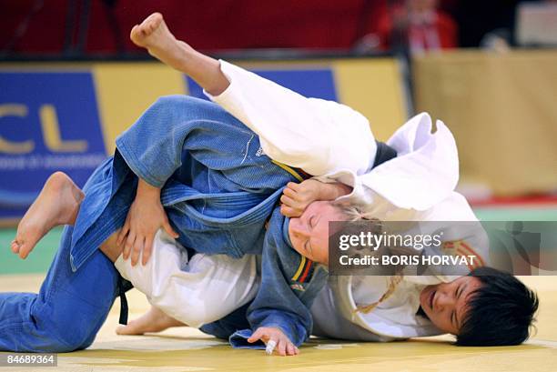 Chinese Yuting Yao battles with German's Kerstin Thiele on February 8, 2009 during their women preliminary round in the 70 kg category on February 8,...