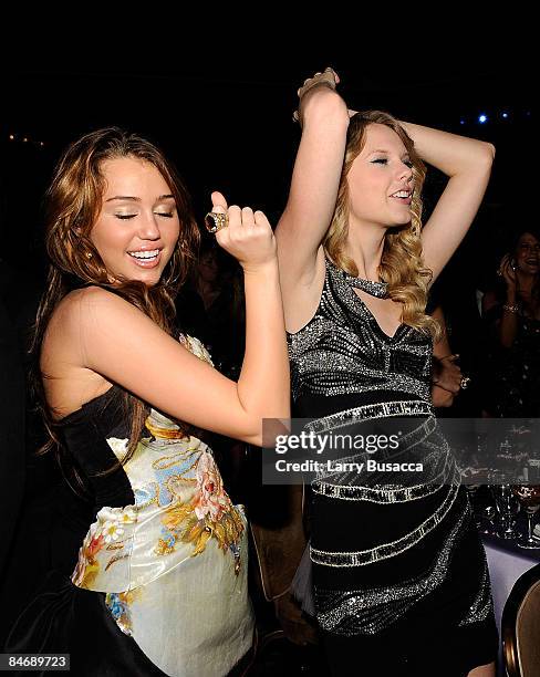 Singers Miley Cyrus and Taylor Swift attend the 2009 GRAMMY Salute To Industry Icons honoring Clive Davis at the Beverly Hilton Hotel on February 7,...