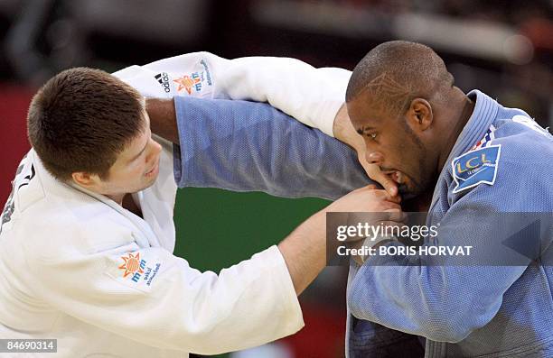 French Teddy Riner battles with Hungarian Barna Bor on February 8, 2009 during their men preliminary round in the +100 kg category at the Paris judo...