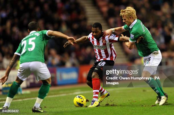 Sunderland's Stepanane Sessegon in action with Norwichs Kyle Naughton and Zak Whitbread during the Barclays Premier League match at the Stadium of...