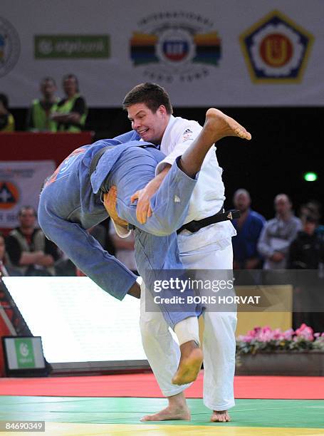 French Teddy Riner battles with Hungarian Barna Bor on February 8, 2009 during their men preliminary round in the +100 kg category at the Paris judo...