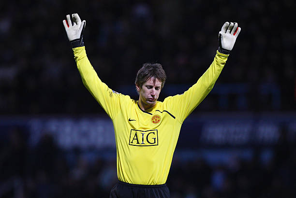 Goalkeeper Edwin Van der Sar of Manchester United celebrates Ryan Giggs' opening goal during the Barclays Premier League match between West Ham...