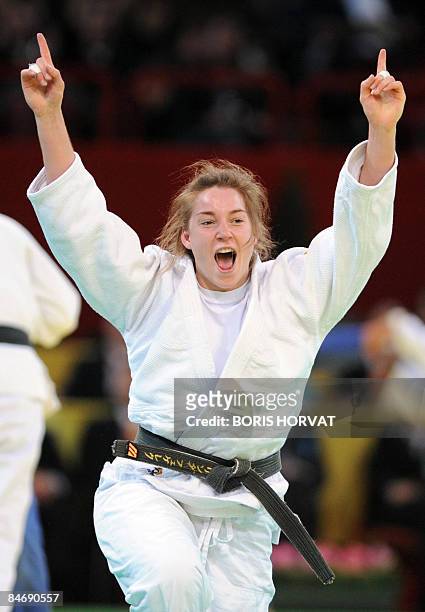 Dutch Marhinde Verkerk jubilates after defeating French Stephanie Possamai during the women quarterfinal round in the 78 kg category at the Paris...