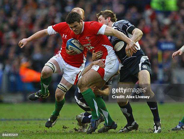 Jamie Roberts of Wales is tackled by John Barclay of Scotland during the RBS Six Nations Championship match between Scotland and Wales at Murrayfield...