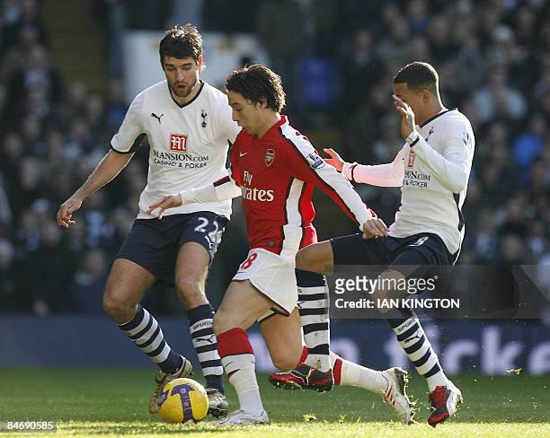 Arsenal's French player Samir Nasri under pressure from Tottenham Hotspurs Croatian player Vedran Corluka and Tottenham Hotspurs Jermaine Jenas...