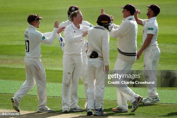 Surrey's Gareth Batty celebrates with team mates after taking the wicket of Yorkshire's Tim Bresnan during day three of the Specsavers County...