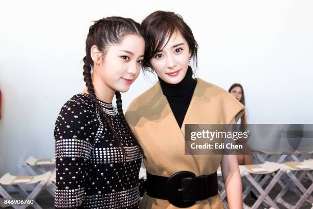 Oyang Nana & Yang Mi attend the Michael Kors runway show during New York Fashion Week at Spring Studios on September 13, 2017 in New York City.