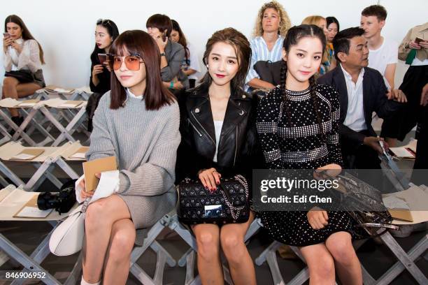 Fil Xiaobai, Ivy Shao & Oyang Nana attend the Michael Kors runway show during New York Fashion Week at Spring Studios on September 13, 2017 in New...